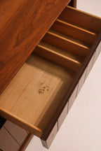 Interior view of cabinet shelf storage space and walnut finish