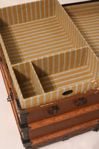 Interior tray organization detail with vintage striped fabric lining