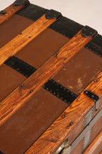 Close-up of iron rivet construction securing wood and leather components