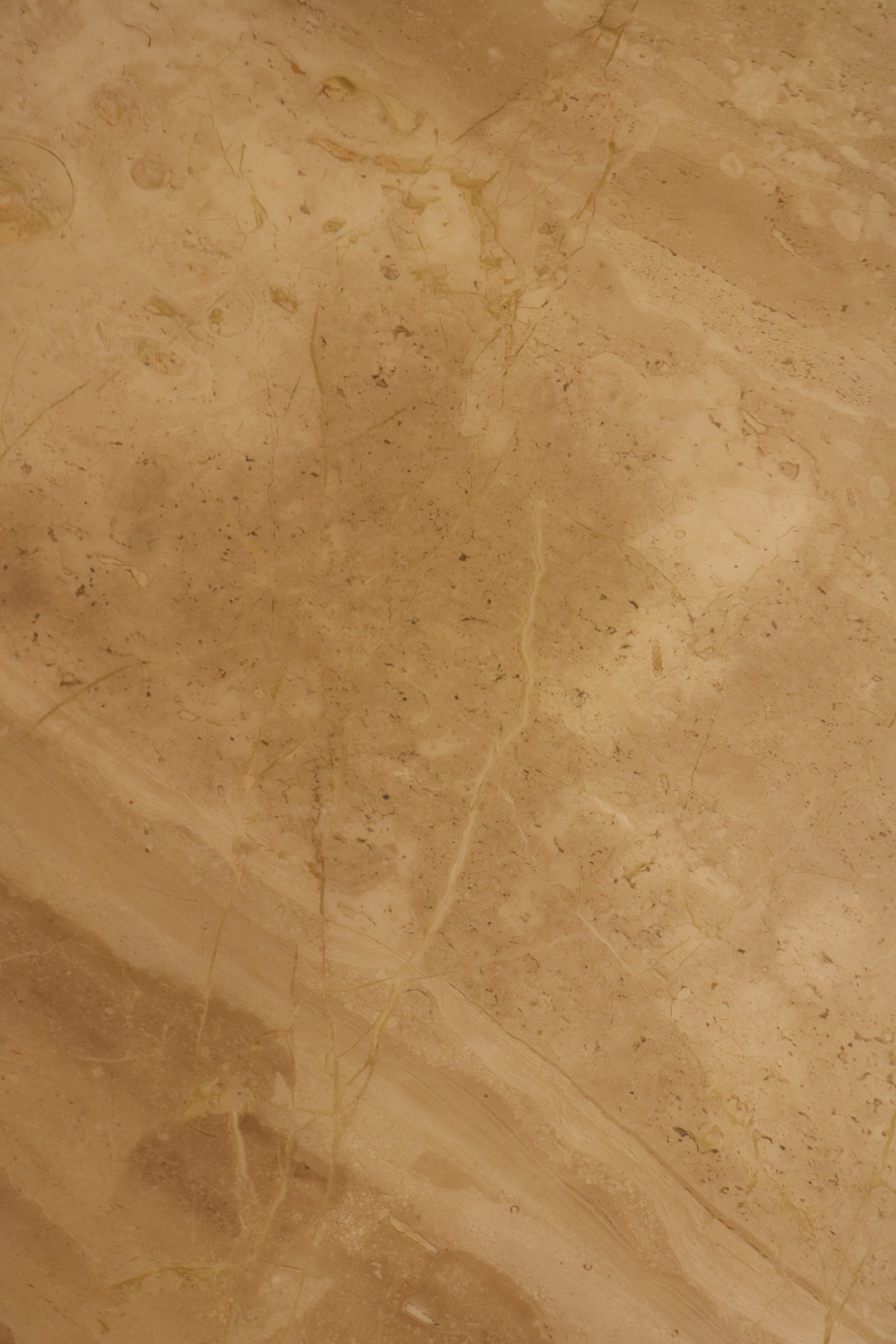 Italian marble top surface detail showing natural beige veining pattern