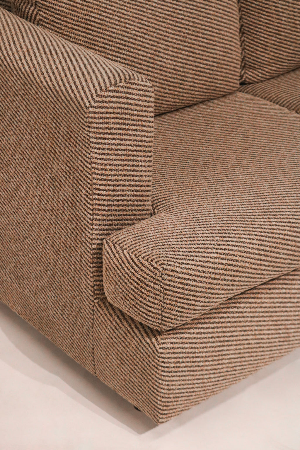 Close-up of the left arm showing fabric texture and clean condition