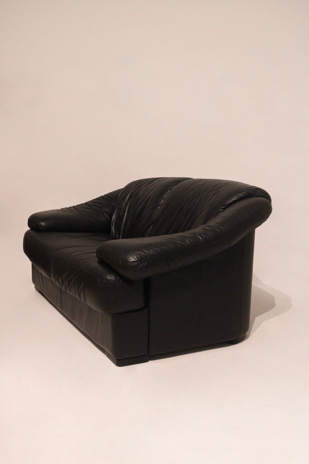 Close-up of left armrest showing genuine leather and light marks minimal wear