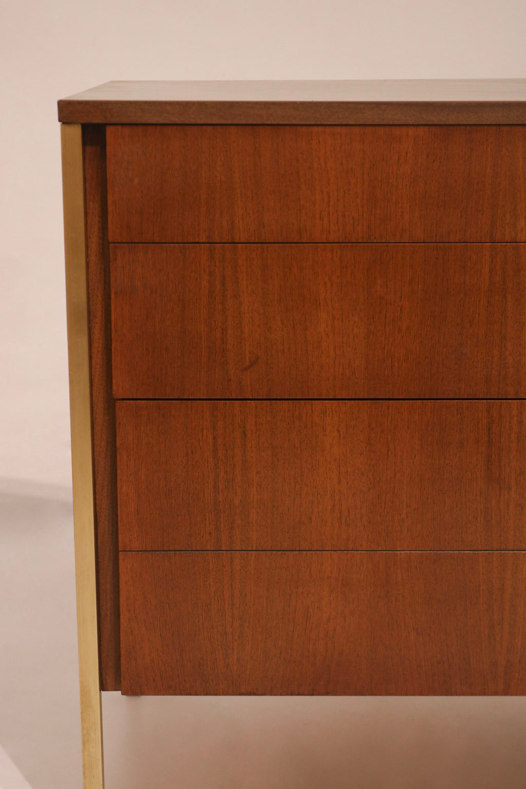 Detail of left corner showing gold accent leg integration