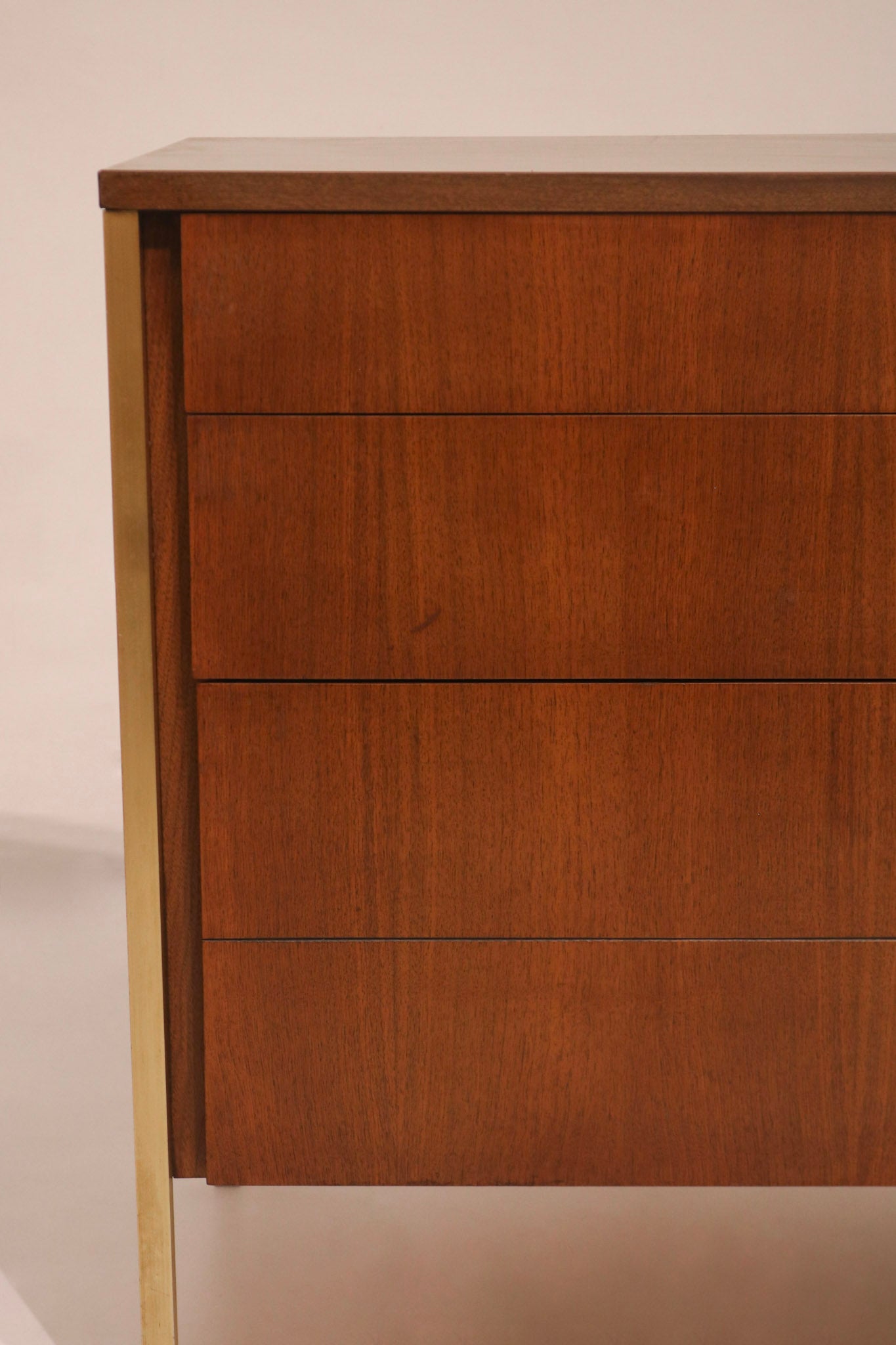 Detail of left corner showing gold accent leg integration