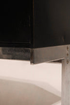 Left side cabinet door open showing interior shelf space