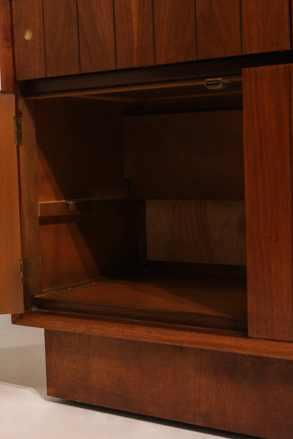 Left side profile view of walnut cabinet showing clean lines and wood grain