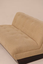 Left side view showing overall condition of the beige vintage loveseat