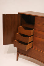 Left side view showing the dramatic curved profile silhouette