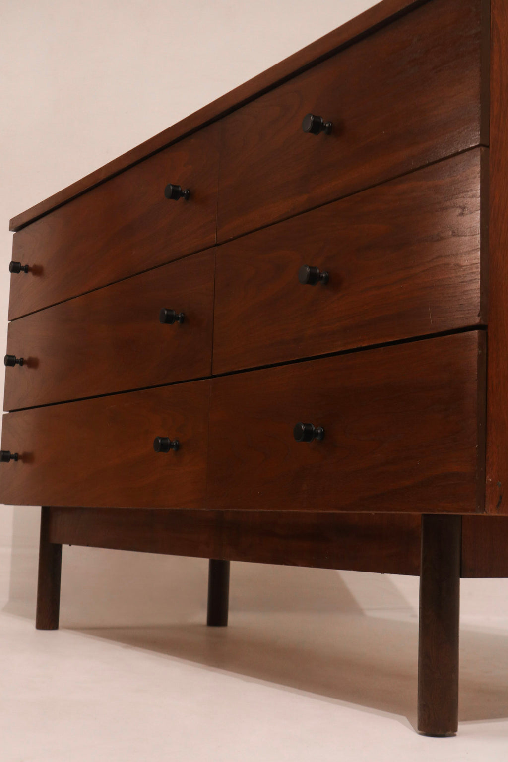 Left side view of walnut dresser profile and leg structure