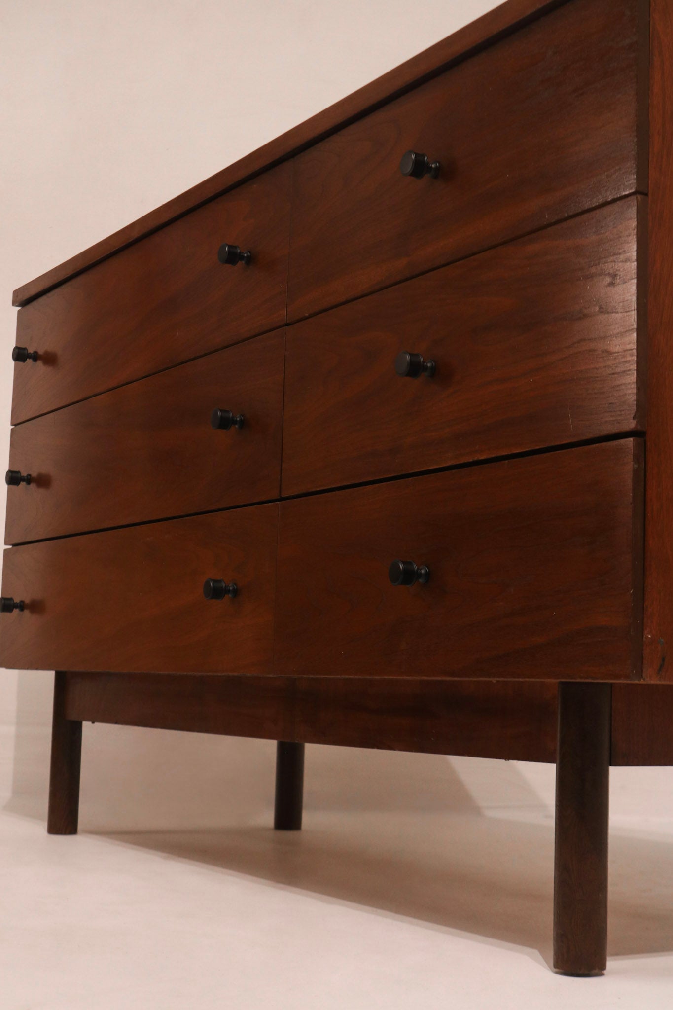 Left side view of walnut dresser profile and leg structure