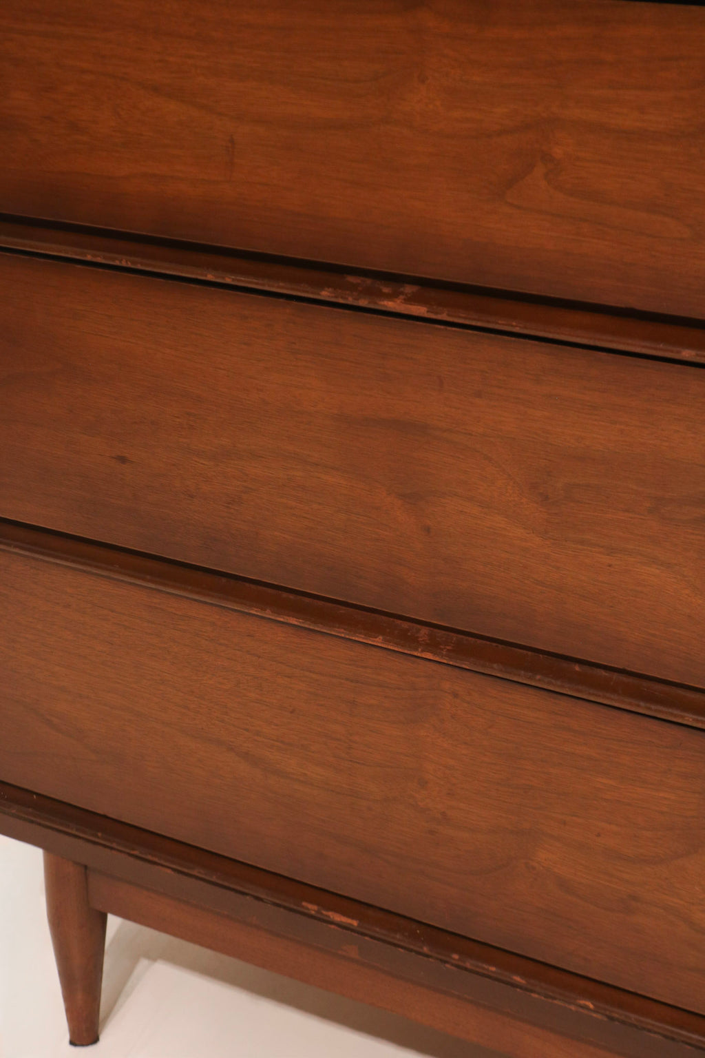 Detail of leg base joint connection to the main dresser body