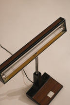 View of the lamp illuminated showing the fluorescent tube lighting