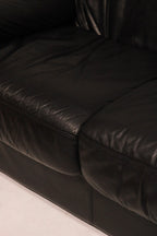 Back view of loveseat sofa showing shape and detailed upholstery stitching