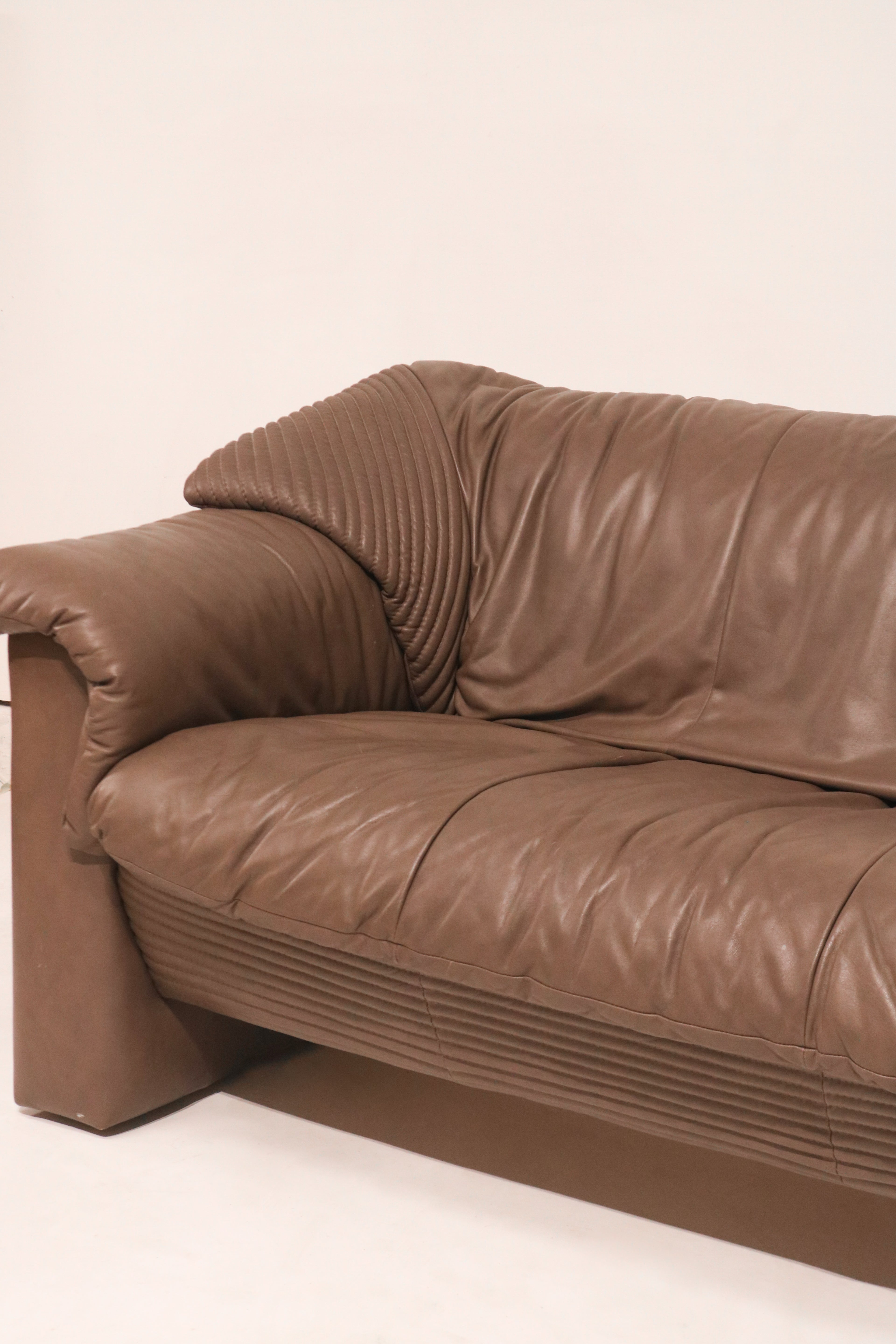 Low rear view showing base construction and leather wrapping