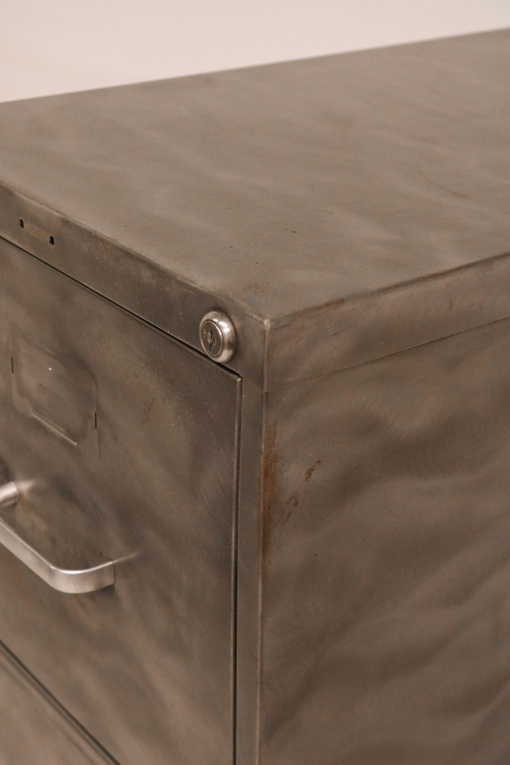 Front view of lower drawers showing consistent metal finish condition