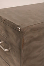 Front view of lower drawers showing consistent metal finish condition