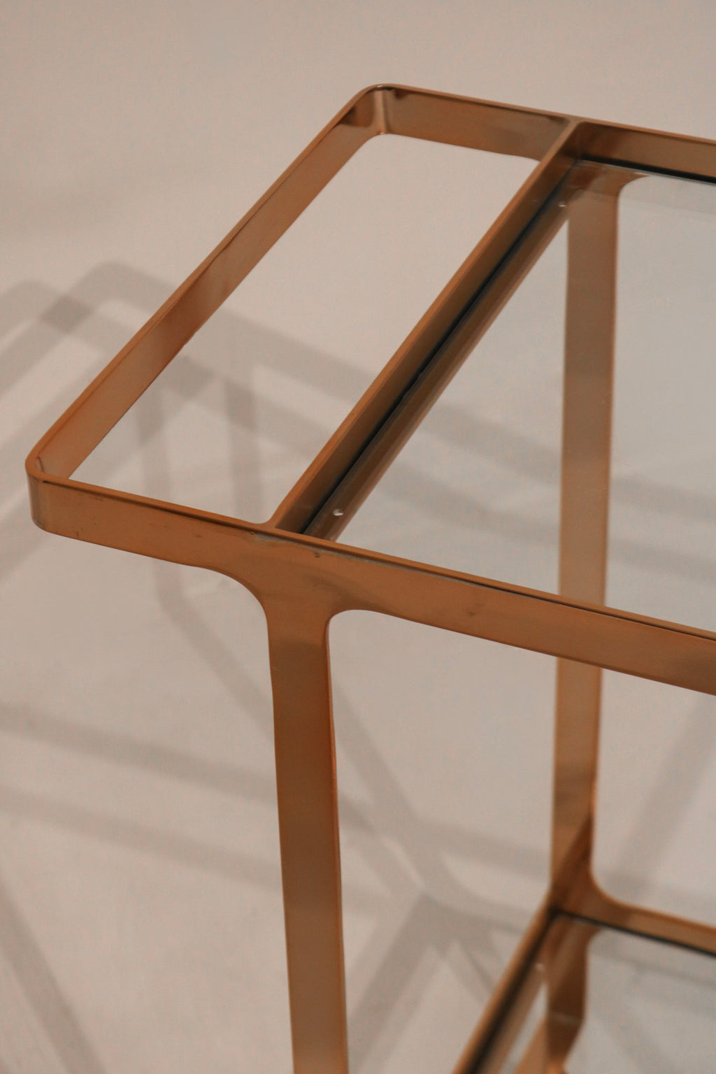 View of lower glass shelf providing additional storage space