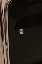 Made in Italy sticker detail on black back panel verifying origin