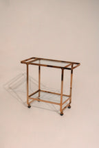 CB2 brass rose gold glass bar serving cart on wheels 35x16x31 inches modern design