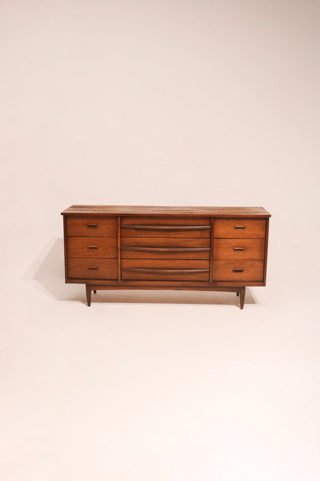 MCM vintage walnut wood dresser 64 inches wide with mid-century modern design