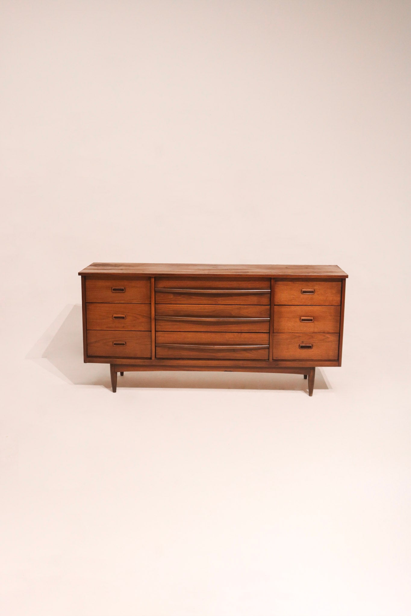 MCM vintage walnut wood dresser 64 inches wide with mid-century modern design