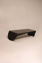 Modern black stone marble coffee table 49 inches with sculptural curved base design