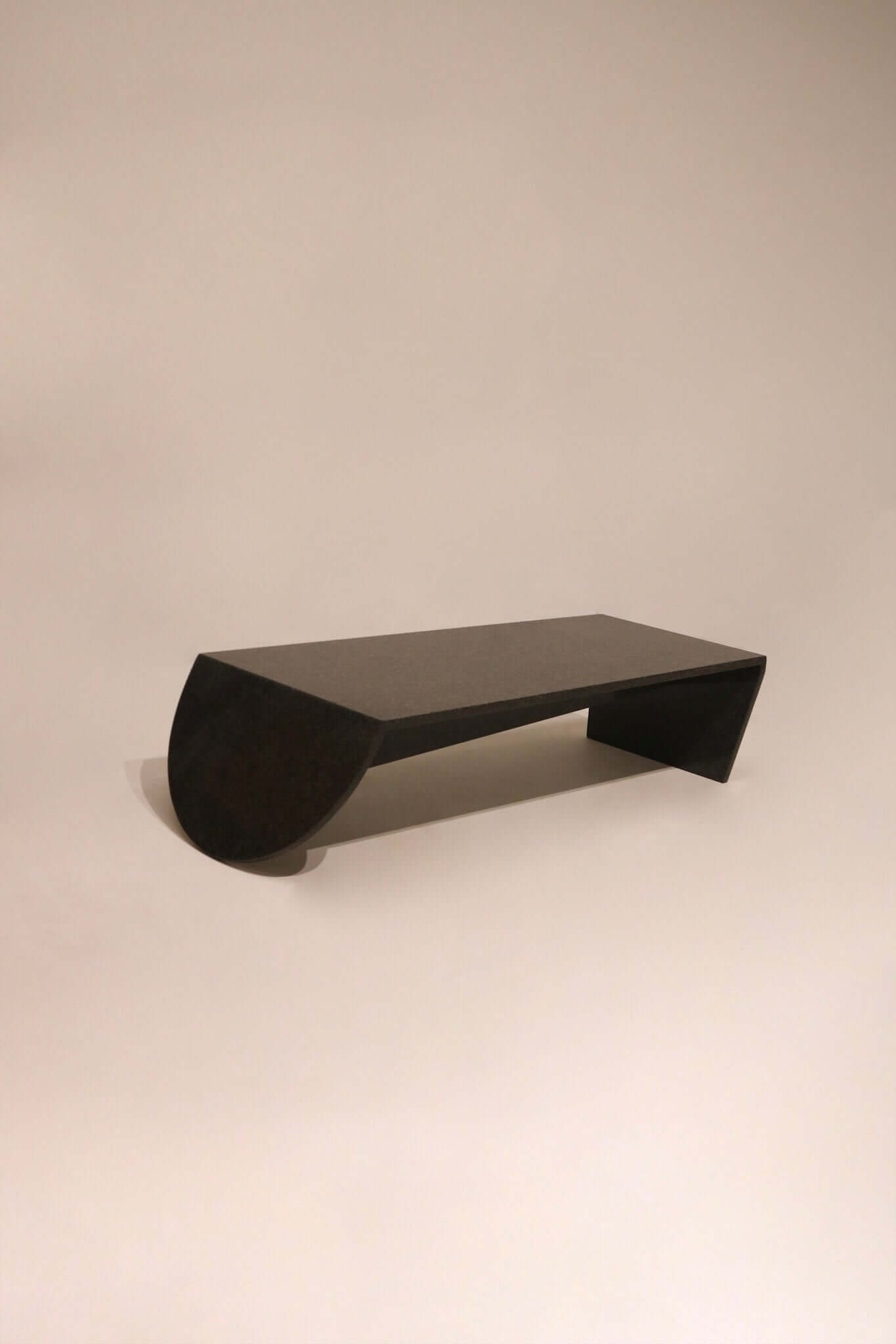 Modern black stone marble coffee table 49 inches with sculptural curved base design