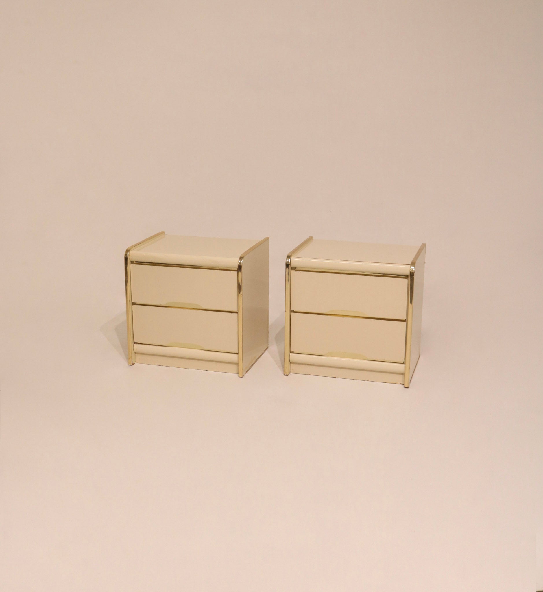 Pair of vintage postmodern lacquered nightstands cream color with gold trim 22 inches