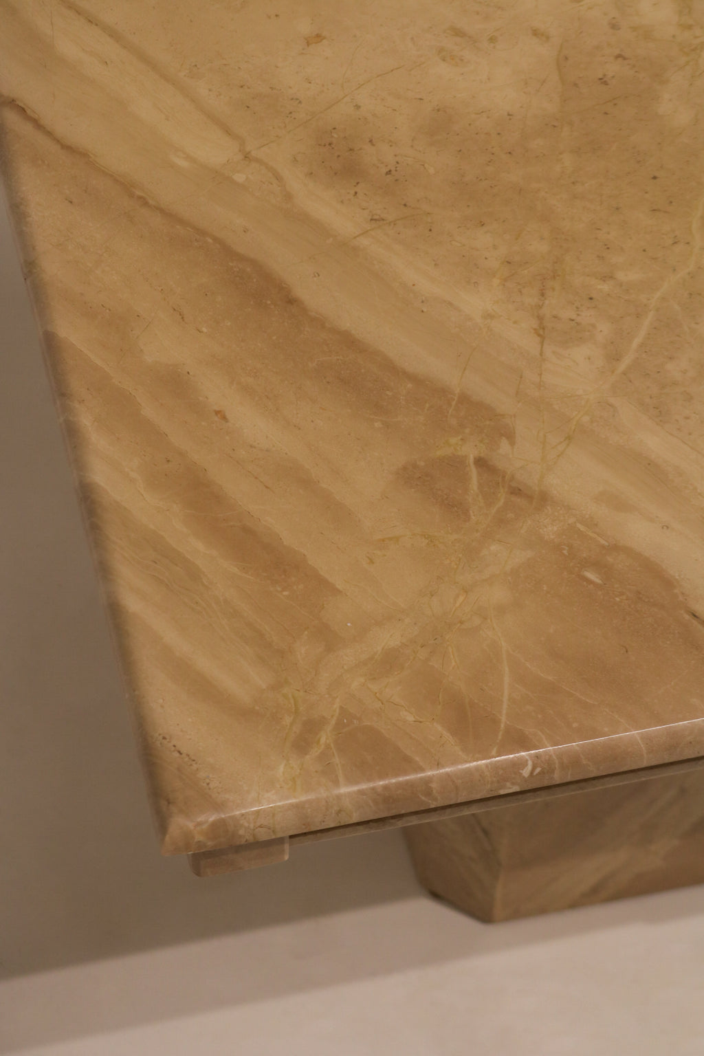 Bottom edge detail of marble base showing thickness and material quality