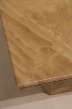 Bottom edge detail of marble base showing thickness and material quality