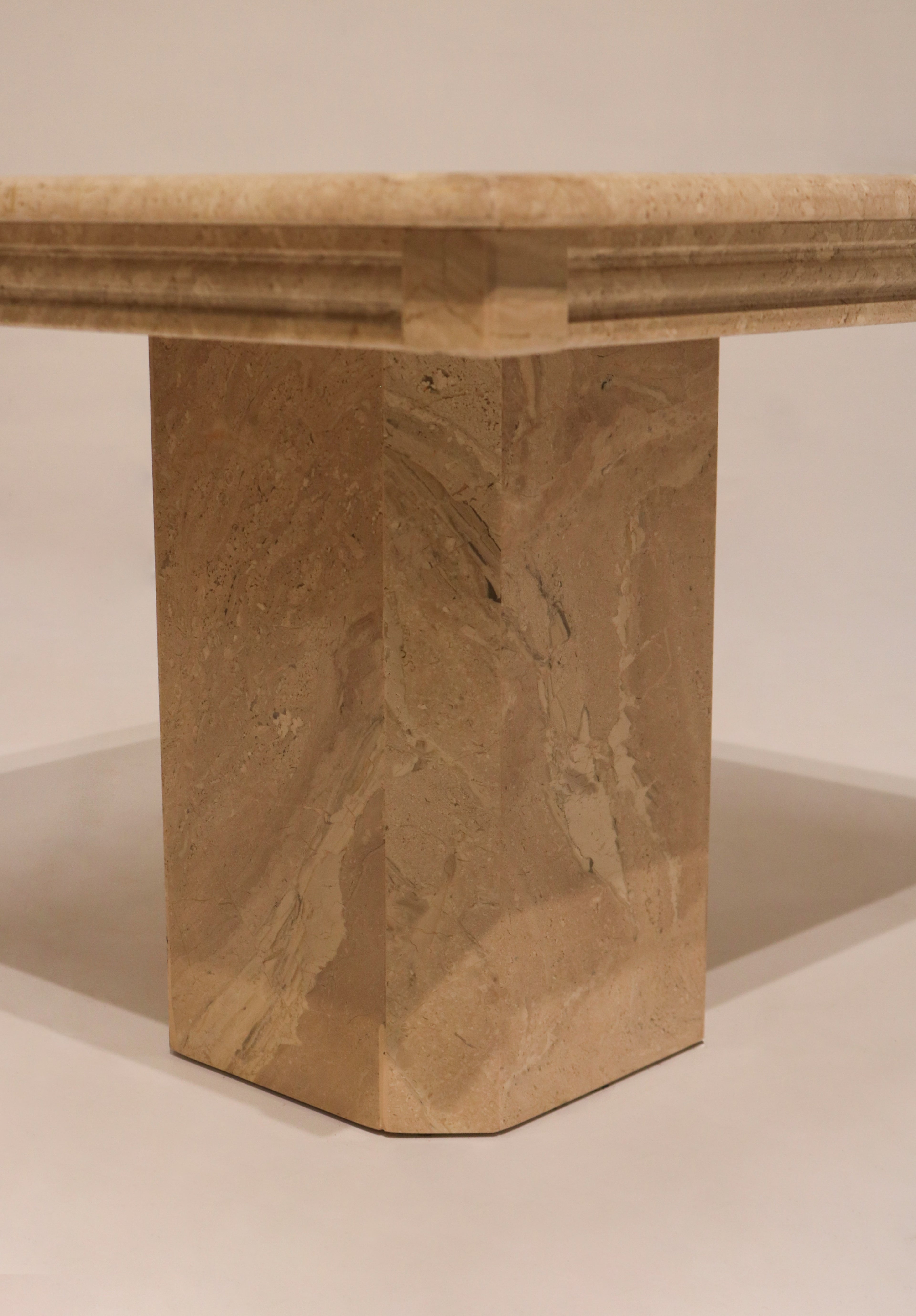 Front view marble base showing geometric faceted design elements