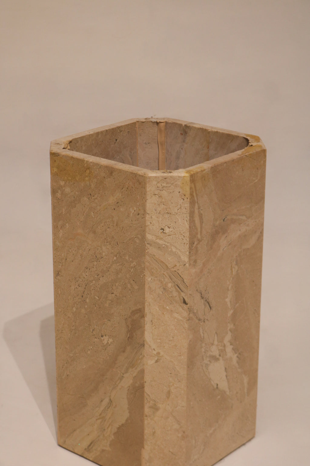 Interior view of marble pedestal base showing hollow geometric construction