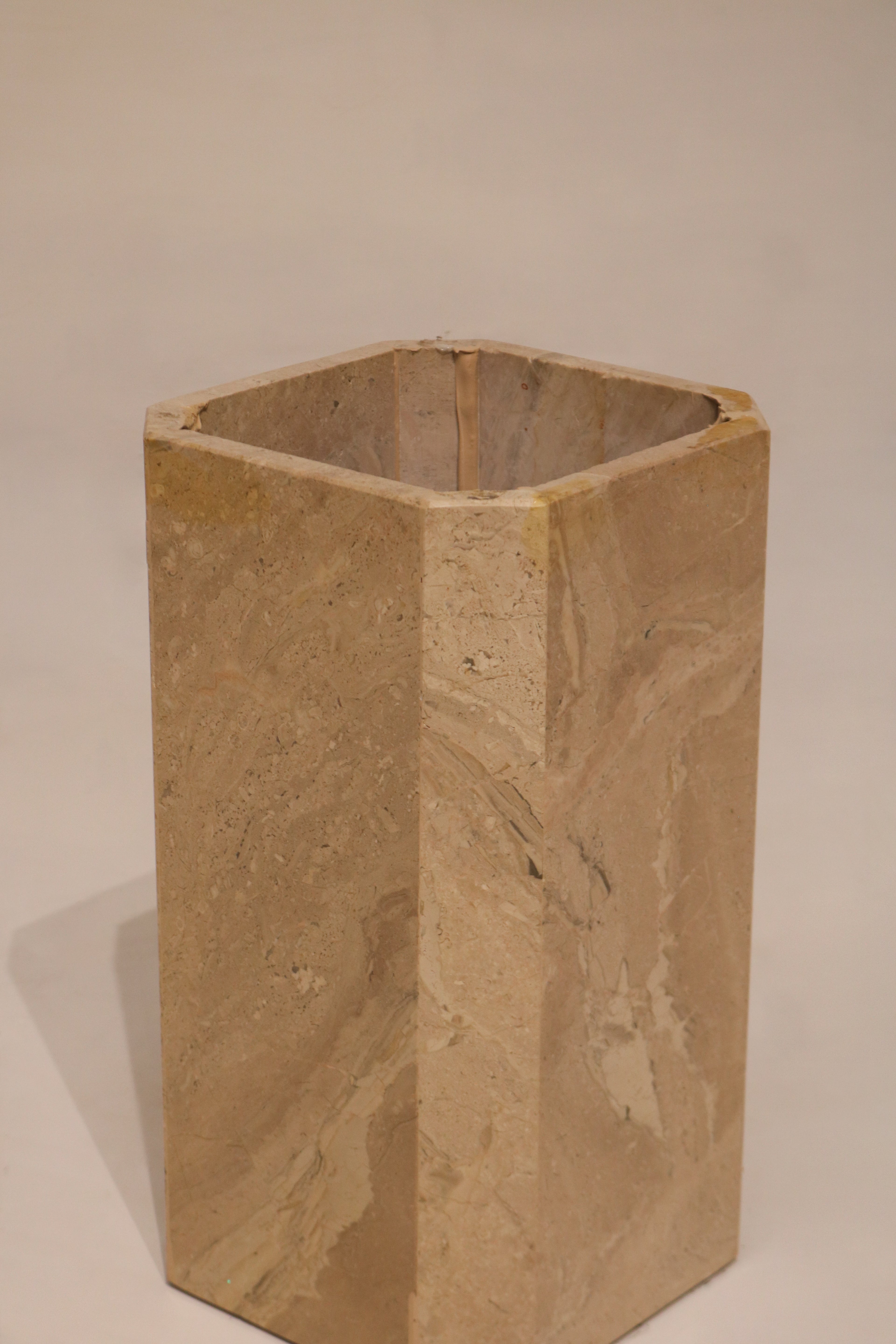 Interior view of marble pedestal base showing hollow geometric construction
