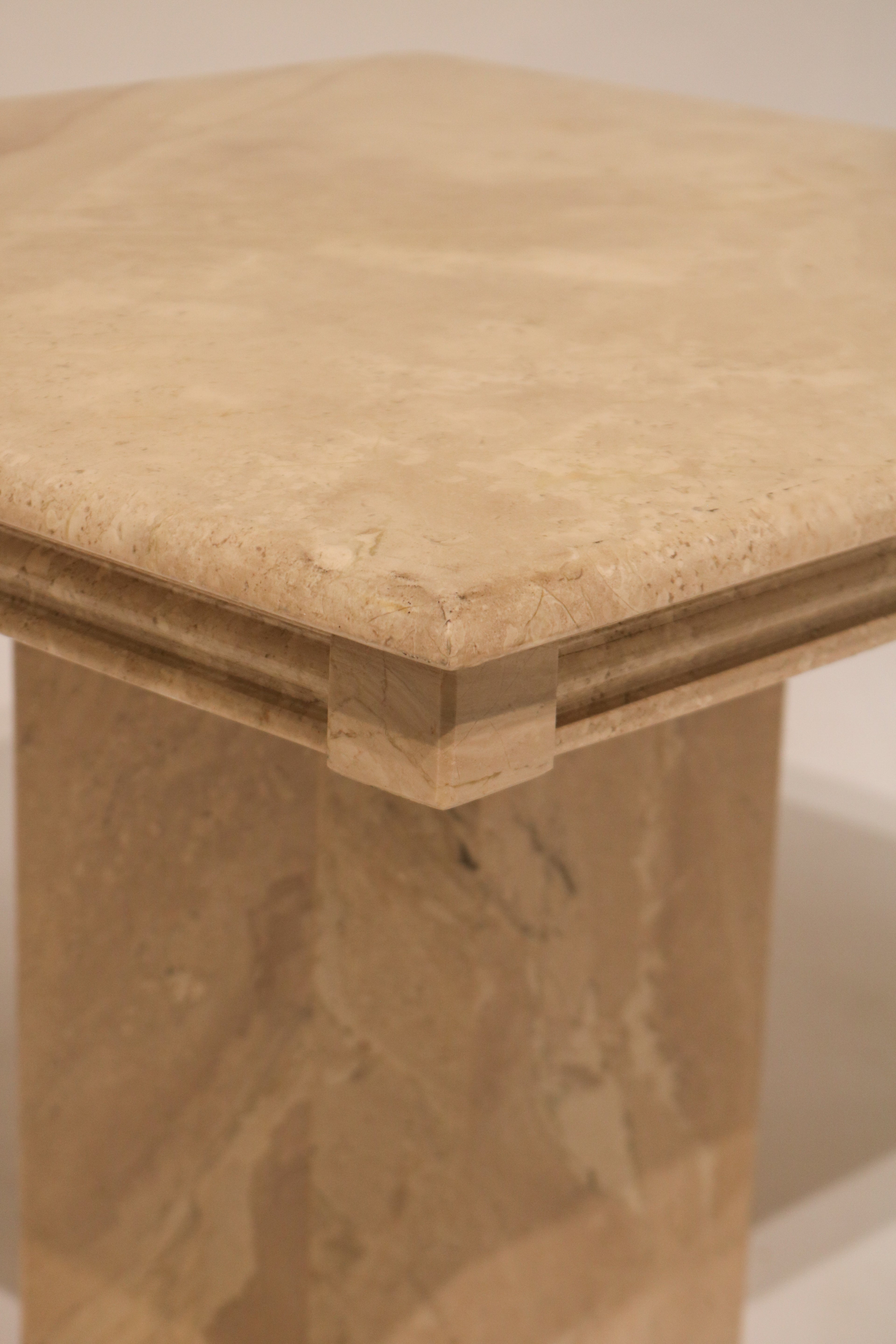 Corner and edge detail of marble table top showing layered construction