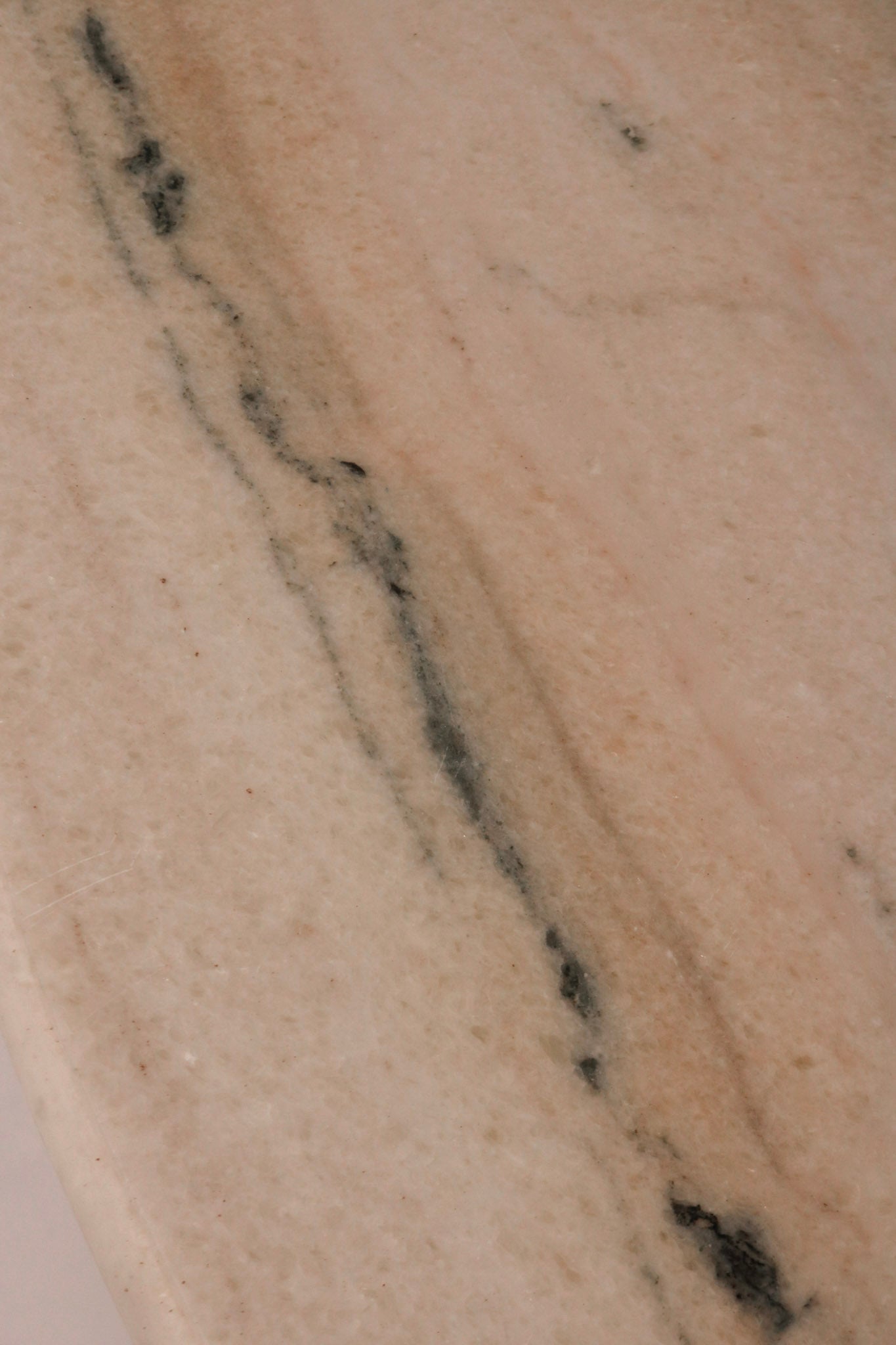 Close-up of white marble top veining pattern and condition