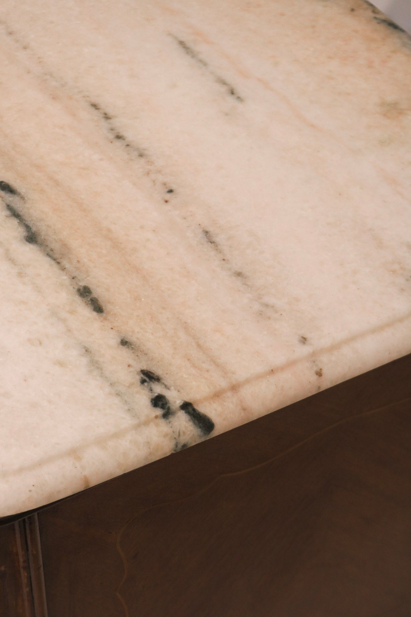 Detailed view of grey veining texture on the white marble surface
