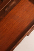 Detail of matched grain veneer pattern across the drawer fronts