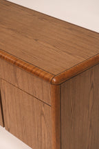Detail of top edge trim showing solid oak finish and craftsmanship