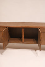 View of open cabinet doors revealing interior shelving and storage space