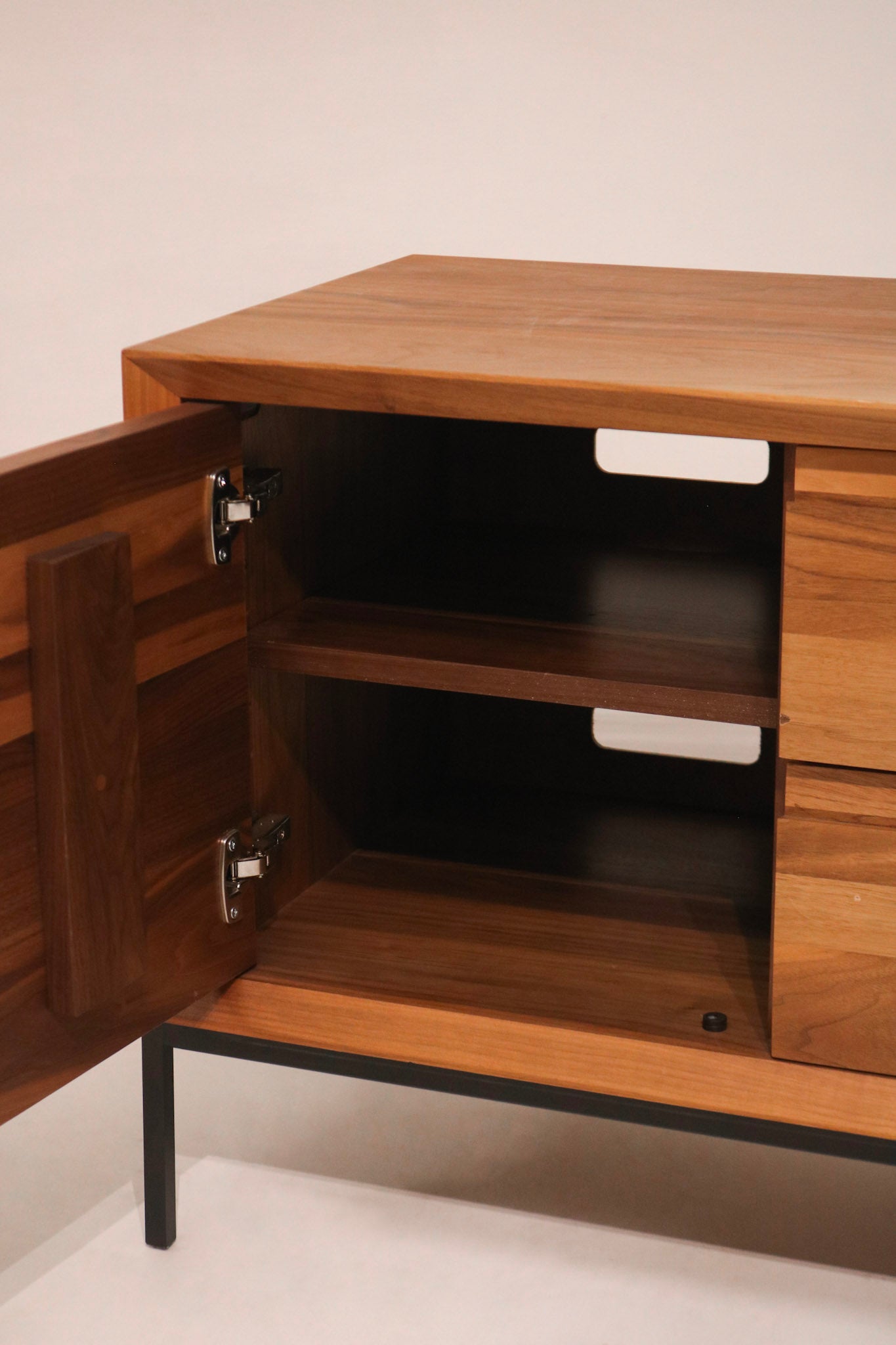 View of open drawer showing maple wood interior and dovetail joinery