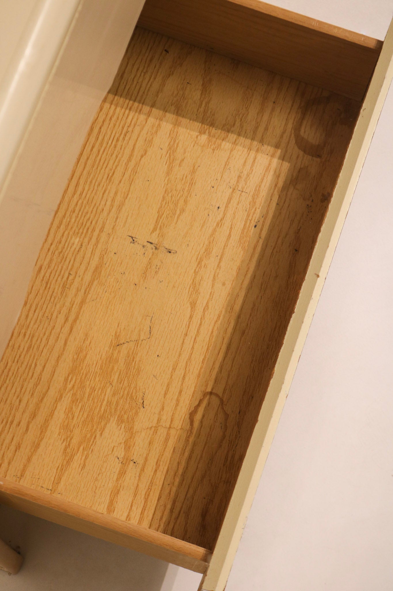 Open drawer view showing interior wood construction and storage depth