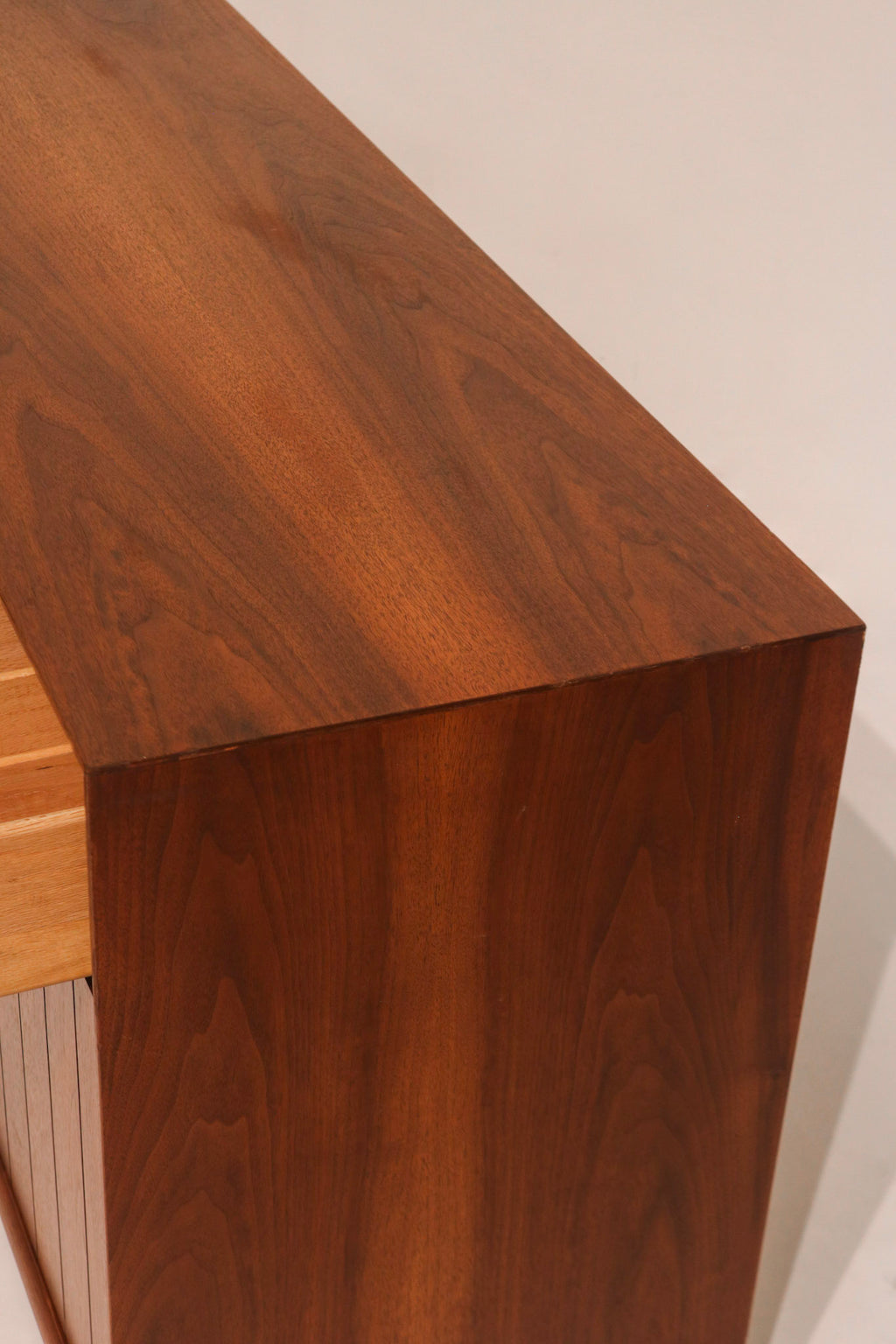 Side view of open drawer showing walnut wood finish and depth