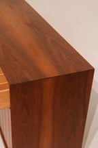 Side view of open drawer showing walnut wood finish and depth