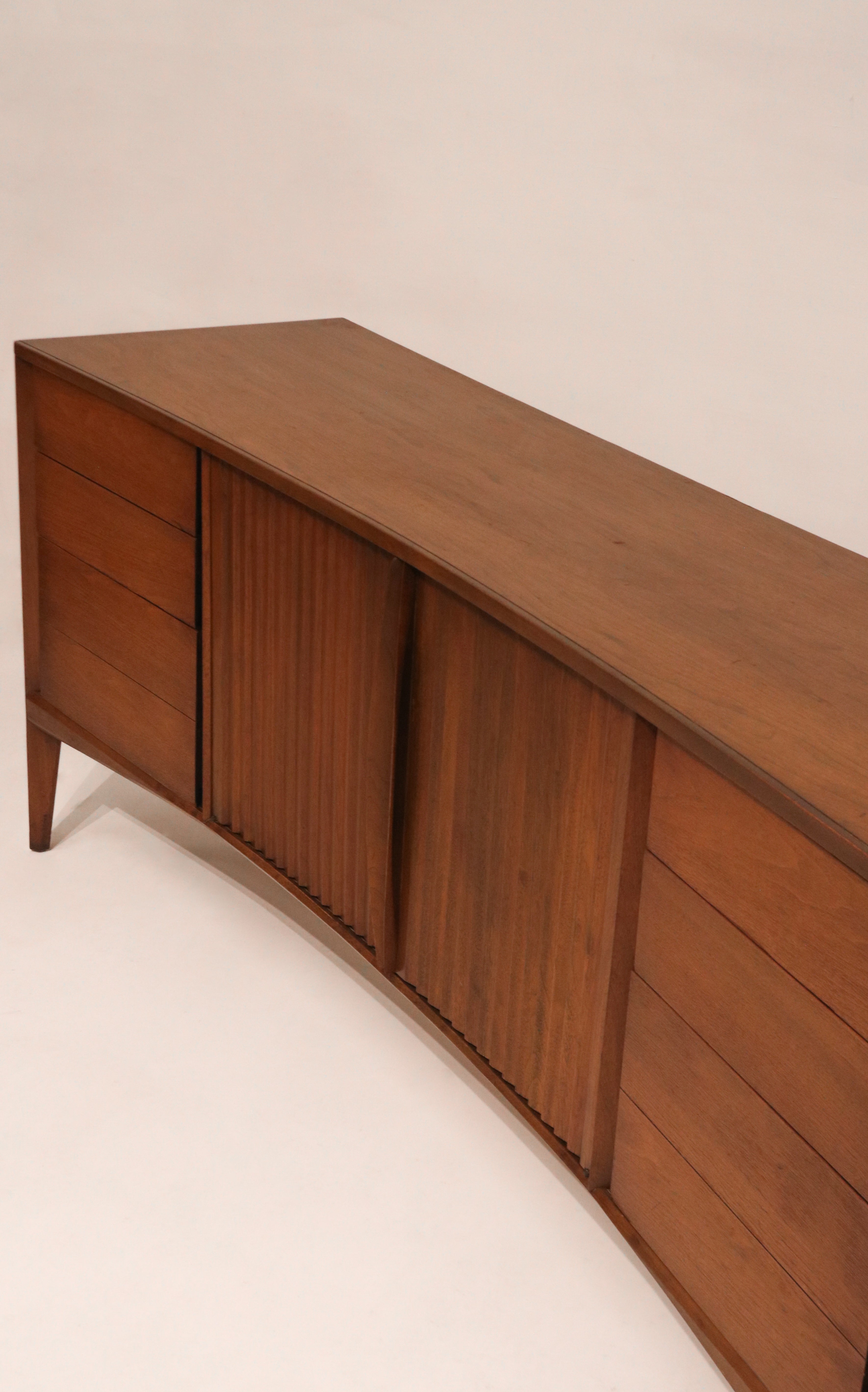 View of open drawers showing storage capacity within the curved design