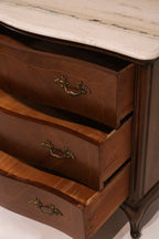 View of open drawers showing storage capacity and curved front design