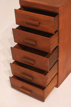 High angle view of open drawers showing vertical storage capacity and wood finish