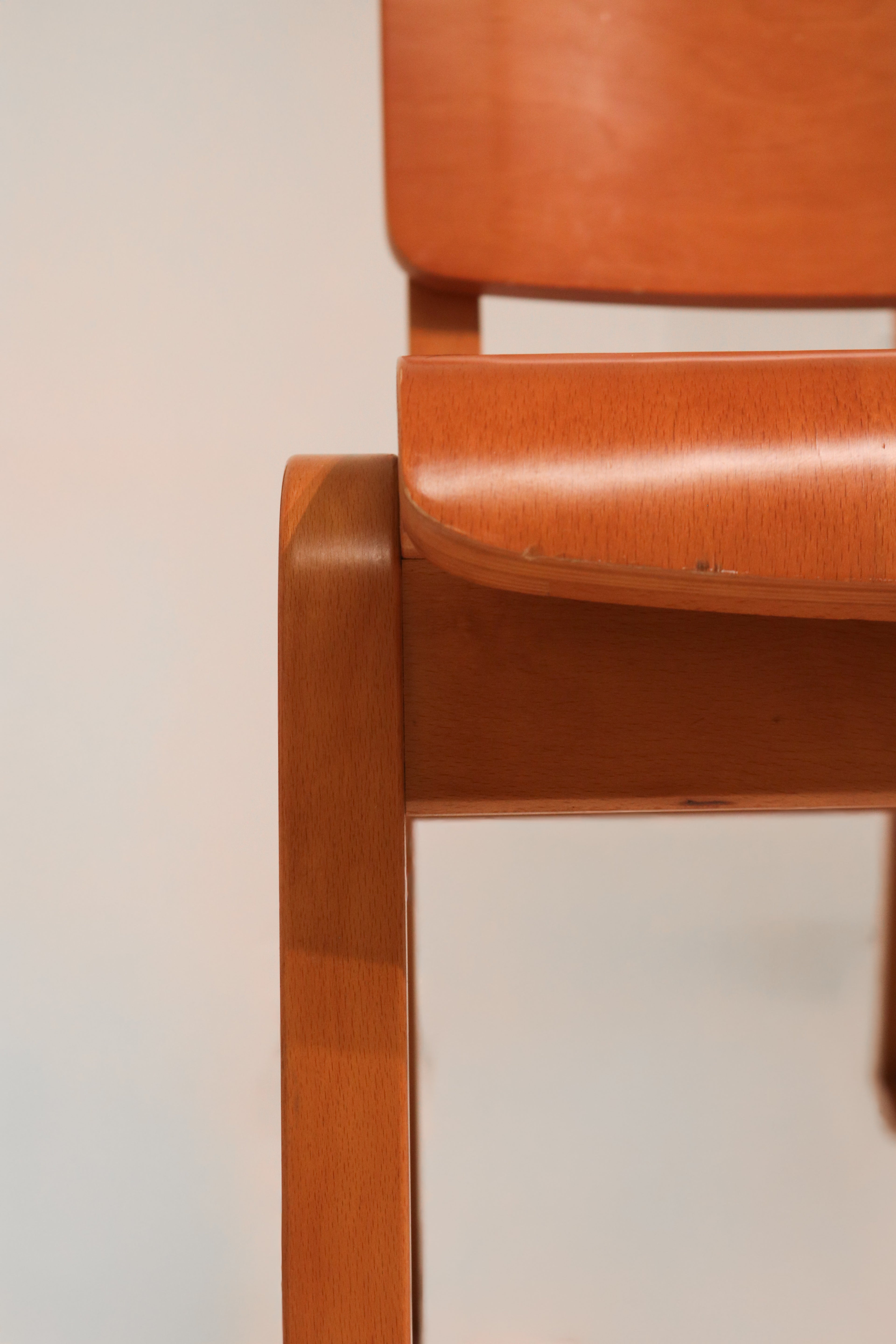 Close-up of plywood seat wood grain texture and warm finish