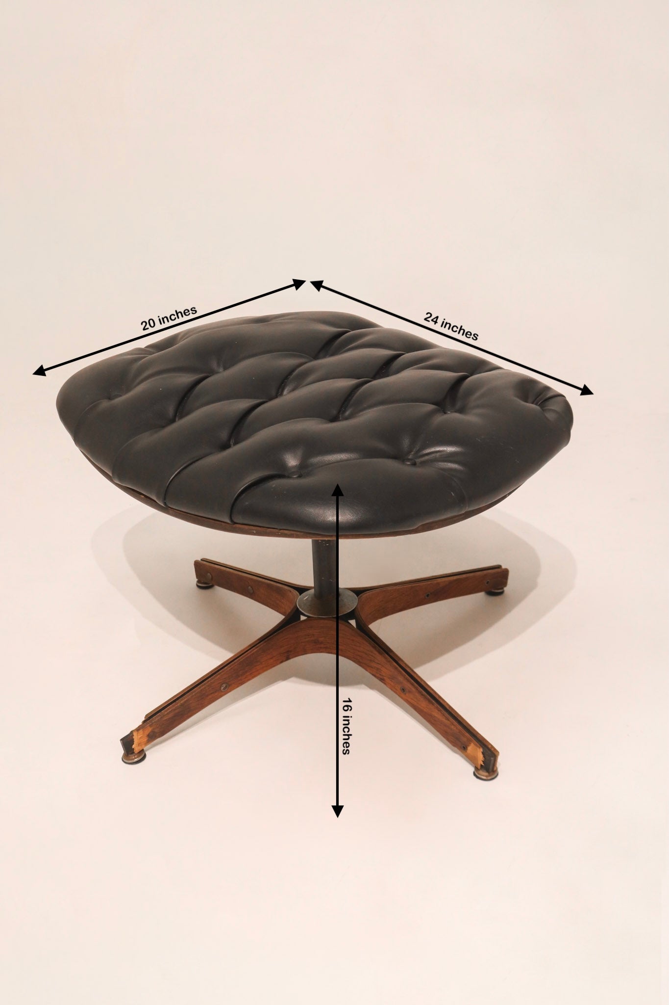 Rear angle view showing the iconic curved plywood shell backrest design