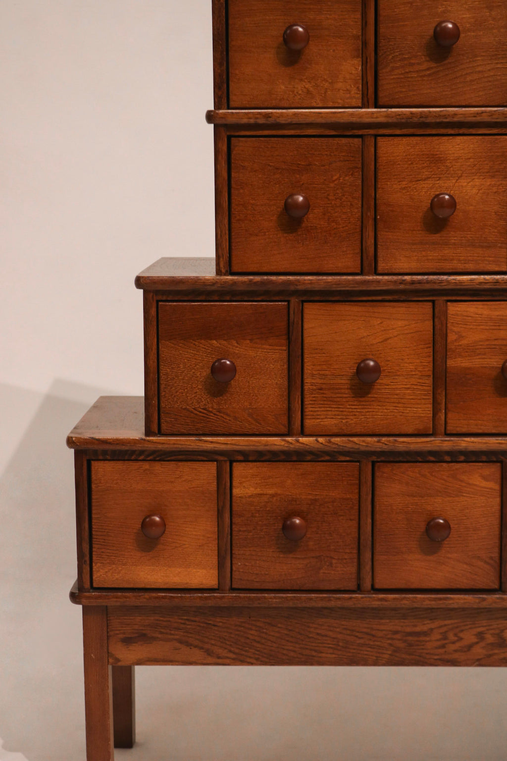 Rear corner view showing cabinet tier panels and wood construction