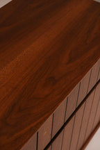 Rear corner view showing solid cabinet construction and finish